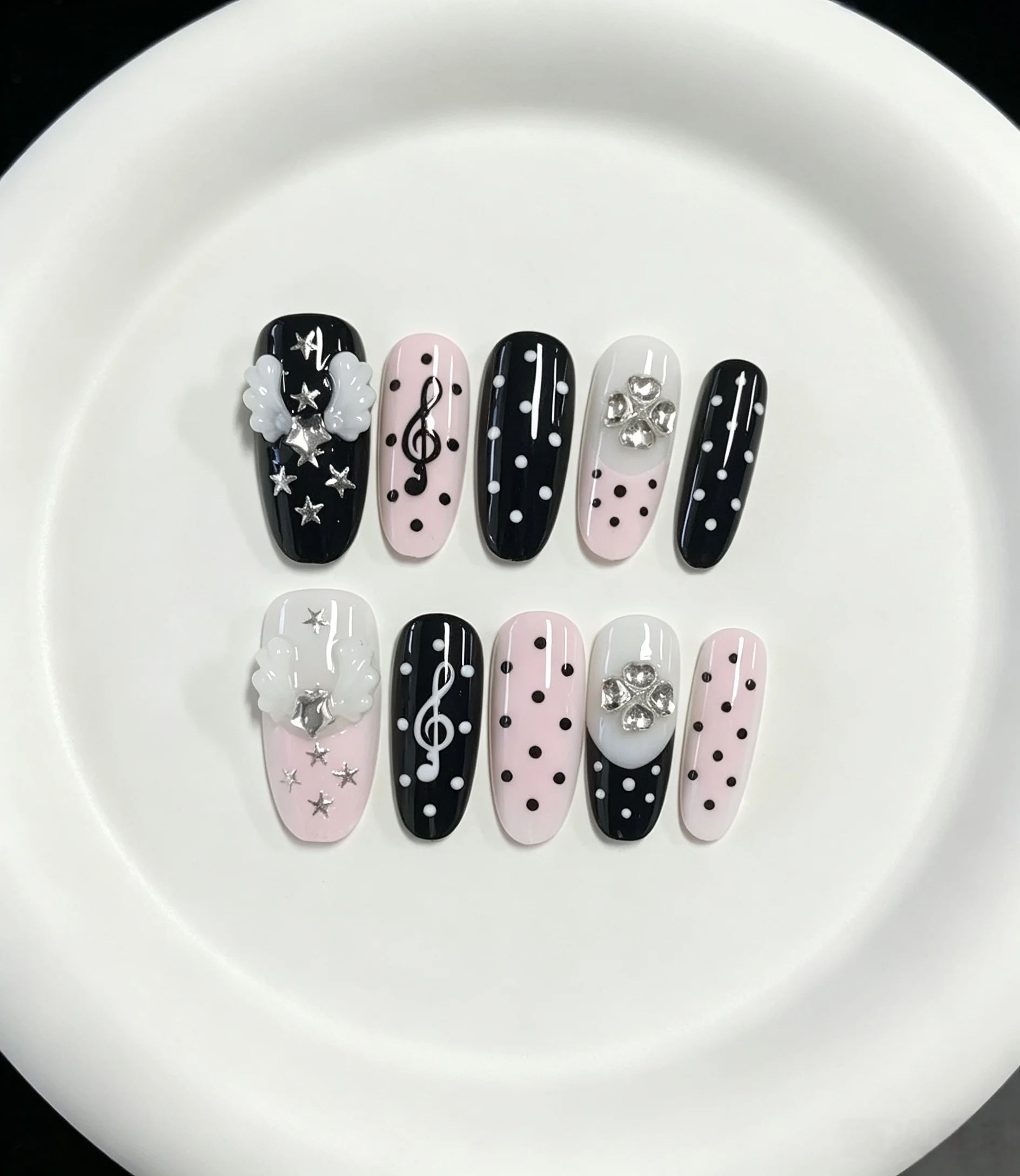 10-Piece Set of Black Polka Dot Angel Wing Long Almond-Shaped Press-On Nails, Featuring Y2K Sweet Girl, Music Girl, Preppy, and Cute Spicy Girl Styles.