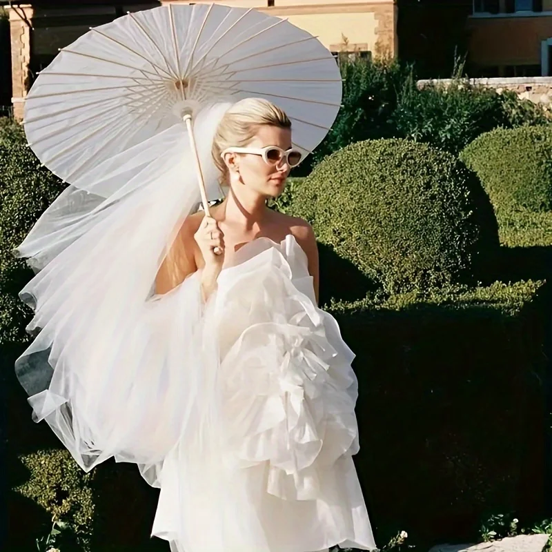 A white paper umbrella for wedding decoration - handmade traditional Chinese bridal sunshade - photo prop and party accessory