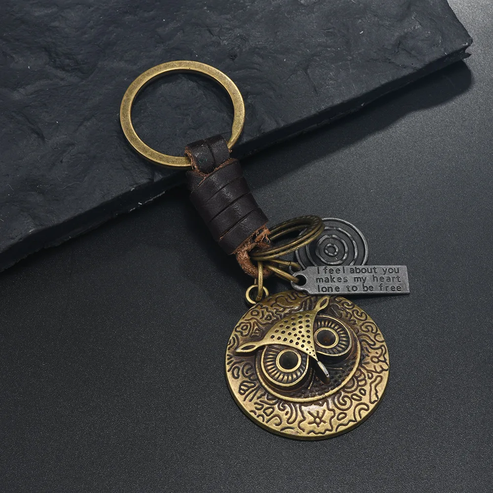 سلاسل المفاتيح الإبداعية الشعبية الأوروبية والأمريكية للرجال والنساء الهدايا سبيكة البرونزية البومة النسر الرجعية المنسوجة قلادة جلد البقر
