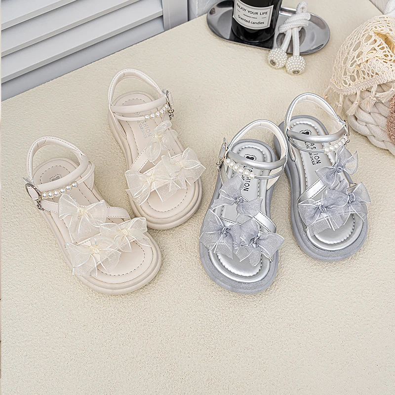 

Fashionable and versatile children's beach sandals sweet bow princess shoes 2026 summer new open toe fashion sandals