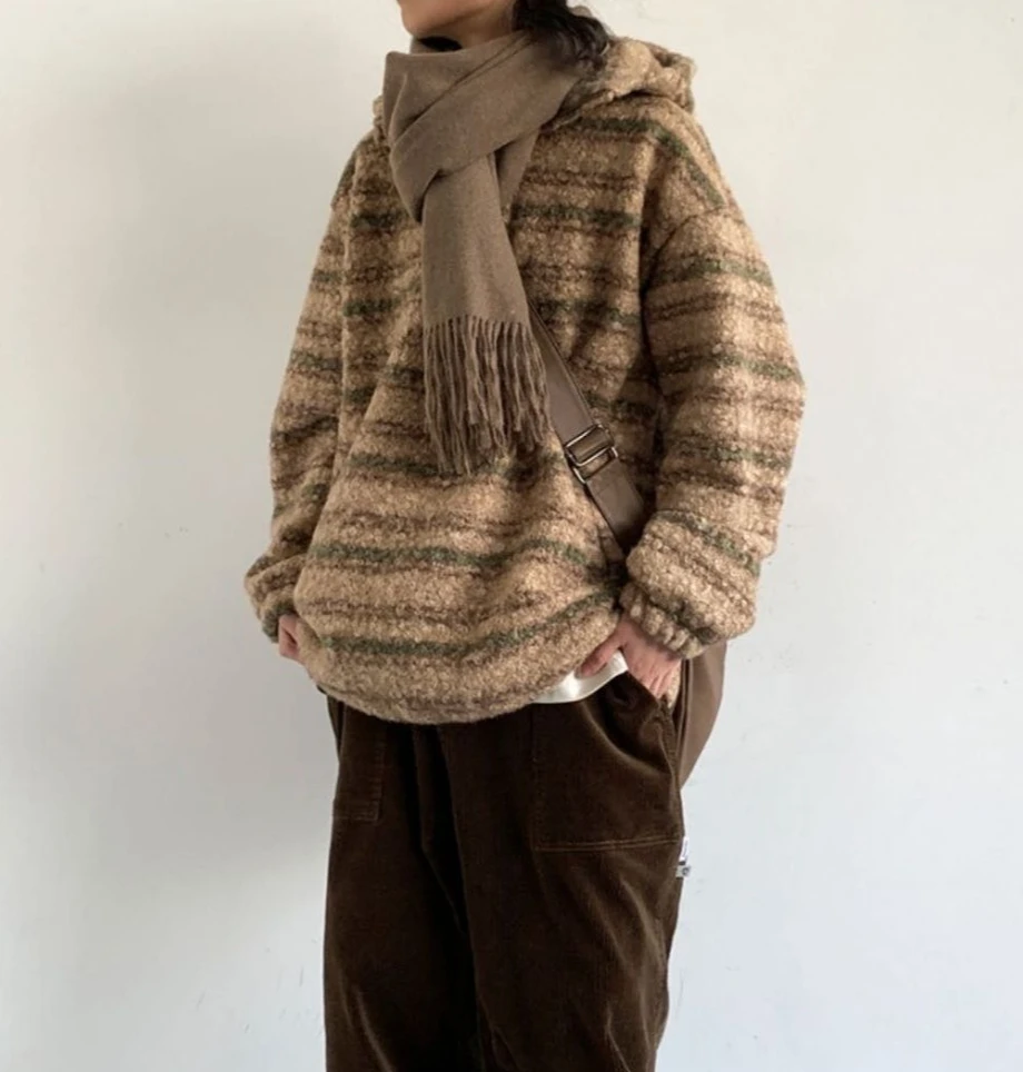 

Lazy Wind Gradually Transforms Into A Woolen Trench Coat with A Hood and A Retro Style.