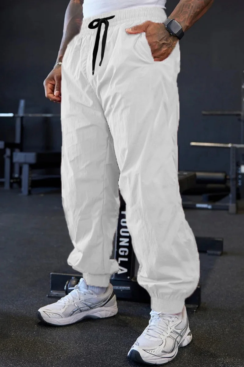 

Spring and autumn men's outdoor sports lightweight stretch pure-color training pants, fashionable sports loose-cuffed long pants