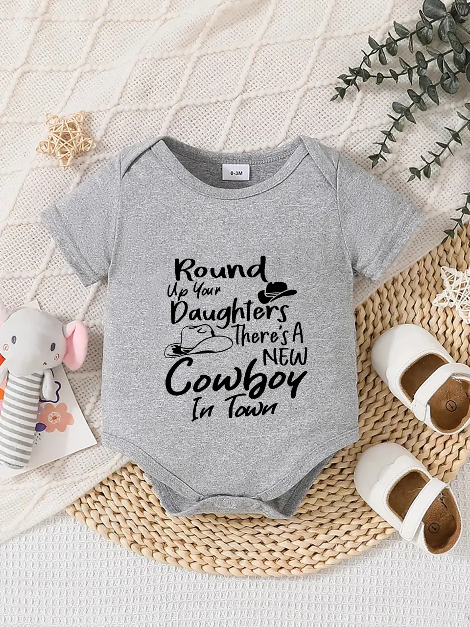 Playful letter-printed baby short-sleeve triangle bodysuit. Button closure for easy dressing, machine washable