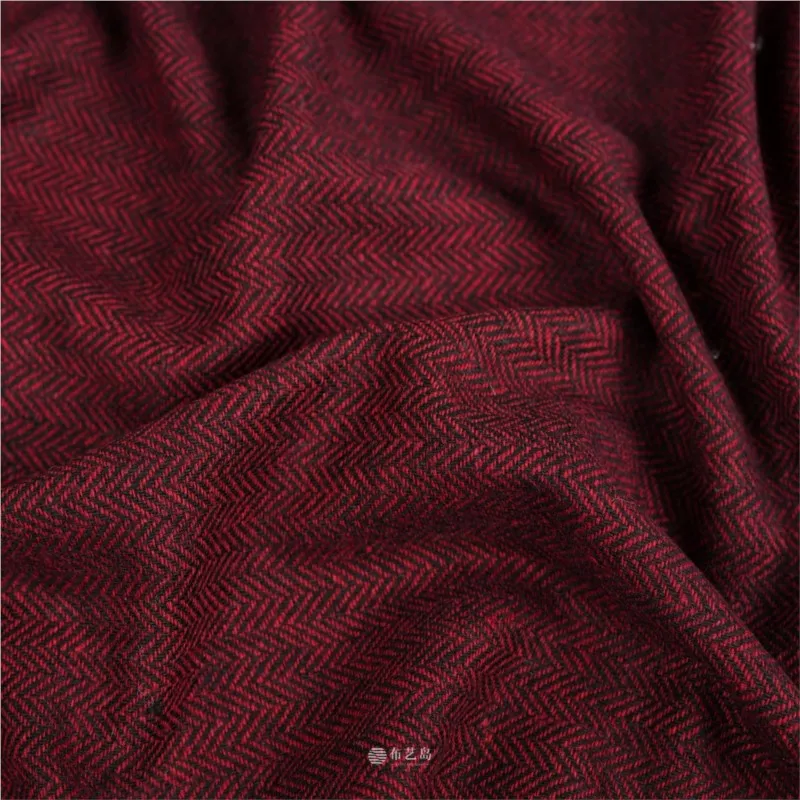 Red and black contrasting letter-patterned fine-spun woolen fabric is used as the for handcrafted outerwear suits
