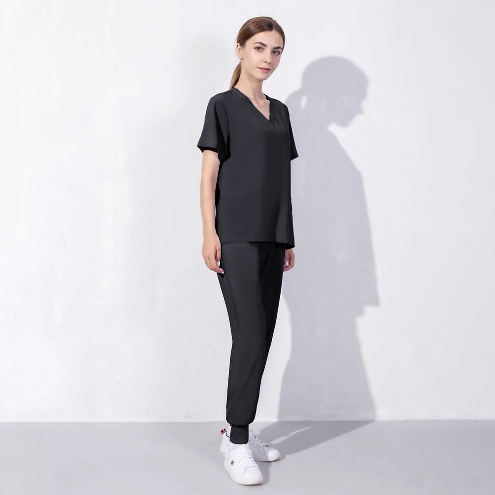 Wholesale Fashion Scrub Suits Hospital Uniform Set Solid Color Unisex Surgical Gown Pocket V-neck Scrubs Set for Women Joggers