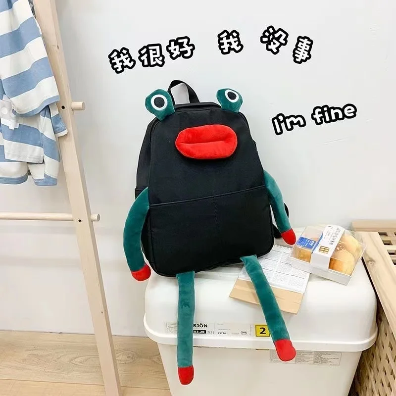 

Backpack, cute girl frog doll personality large capacity backpack middle and high school students funny ugly cute travelling