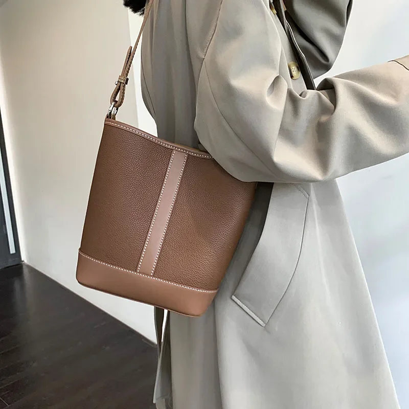 

2023 new leather bucket bag commuter single shoulder crossbody head layer cowhide women's bag