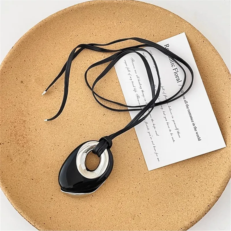 Retro light luxury black agate round leather rope long necklace female niche design irregular pendant sweater chain tide