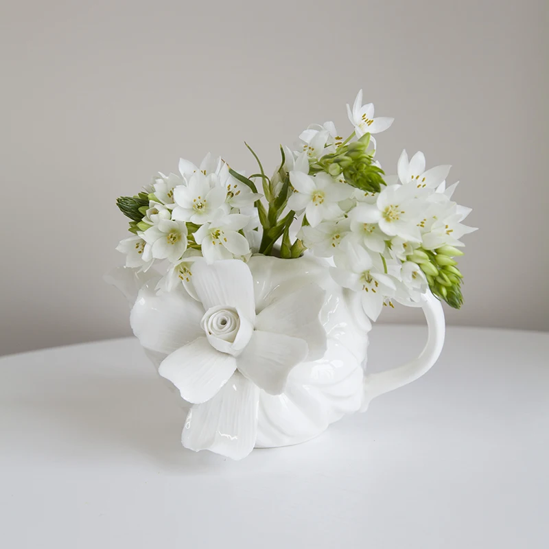 European hand-made three-dimensional glued flowers, old-fashioned porcelain, teapot, vase, flower