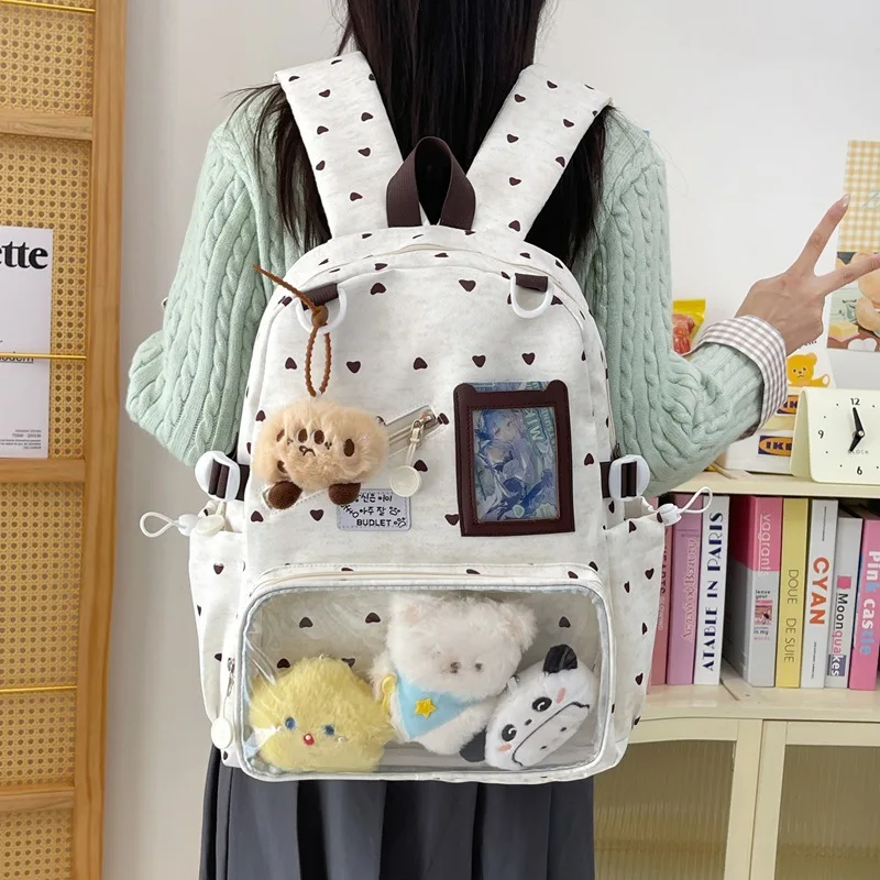 Cute girl's heart-shaped backpack, a stylish and attractive school bag for middle school girls, in a Korean styleinsNiche backpa