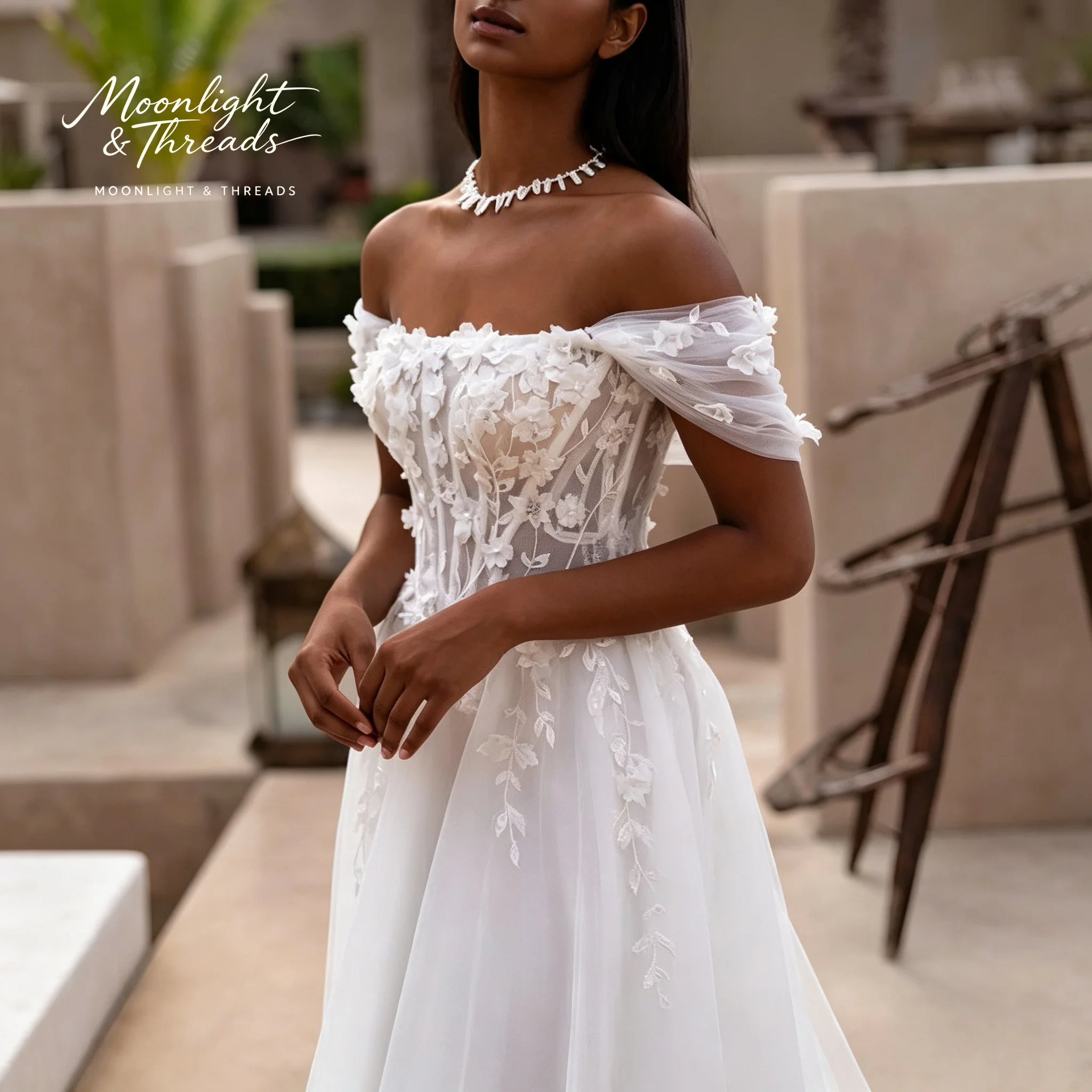 White off-shoulder strapless sleeveless A-line dress floor-length formal occasion wedding dress with boning and appliqué details view 2