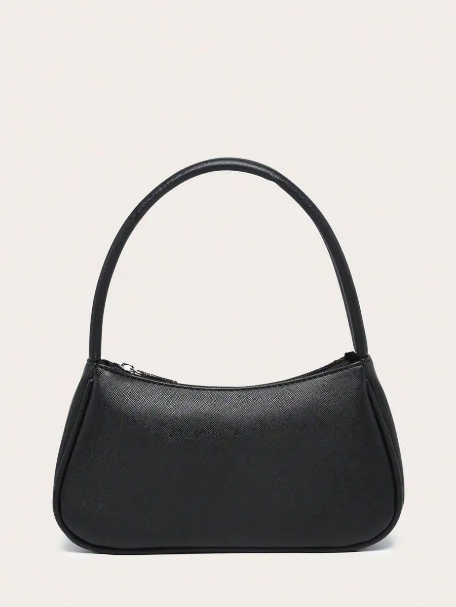 

Женская сумка квадратной формы с текстурированным, минималистичным и стильным дизайном для шопинга и прогулок.