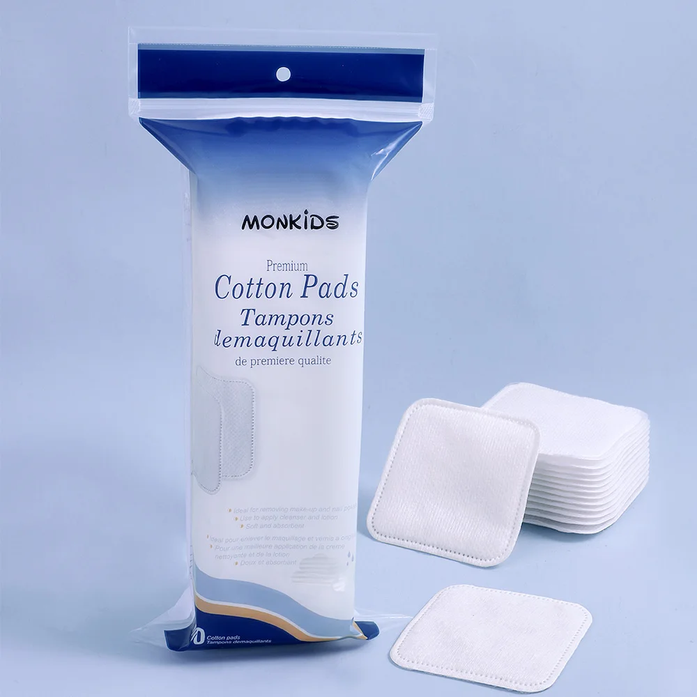 柔らかく通気性のある正方形のメイク落としパッド 100 枚、両面テクスチャードコットンパッド、スキンケアや洗顔に使用されます。