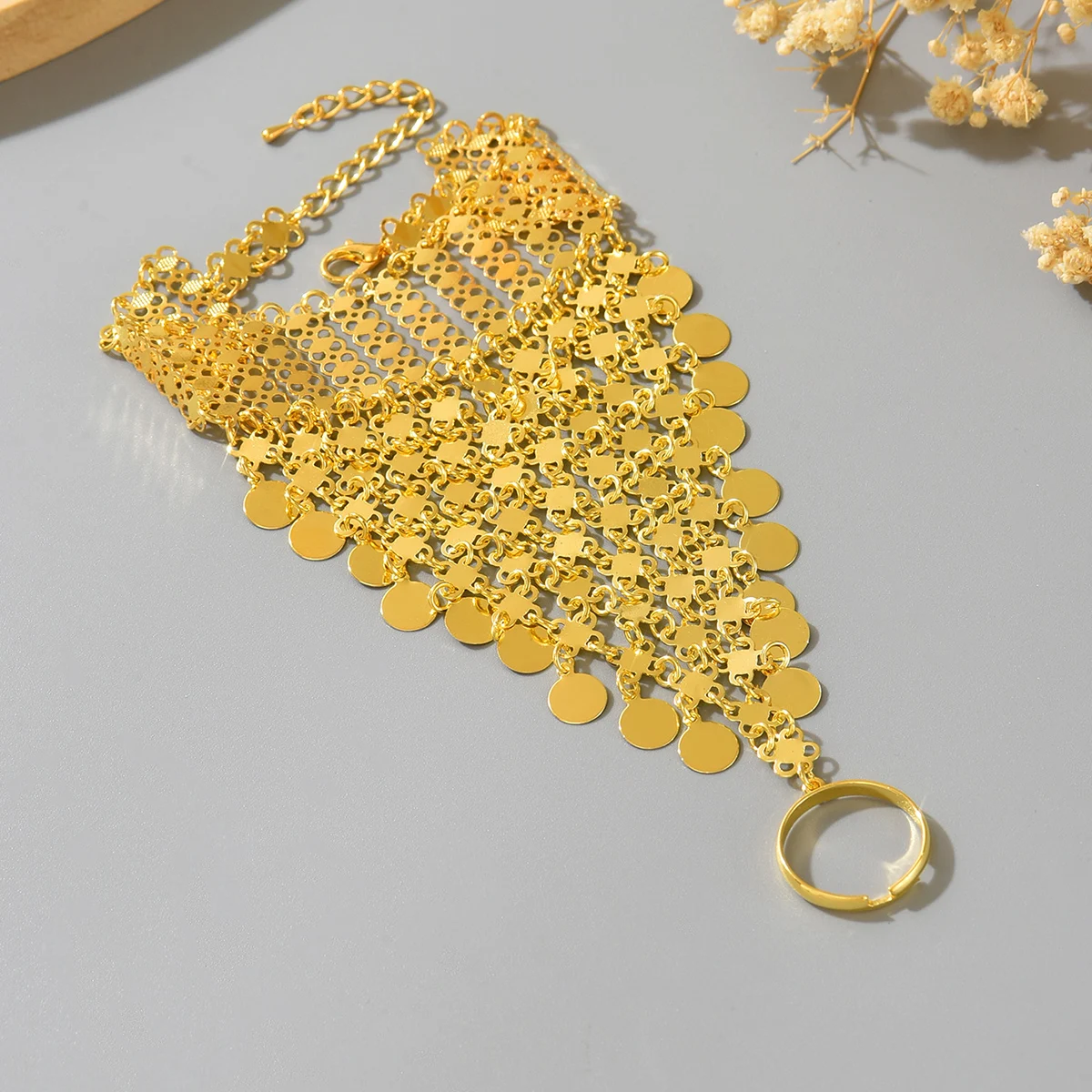 A Retro Ethnic Style Metal-Gilded Hollow-Carved Round Pendant Tassel Personalized Design Finger Chain