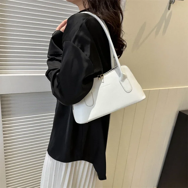 Bolso de hombro de marca de lujo para mujer, bolso de hombro femenino Simple, bolso de viaje informal, tendencia de moda, nueva tendencia