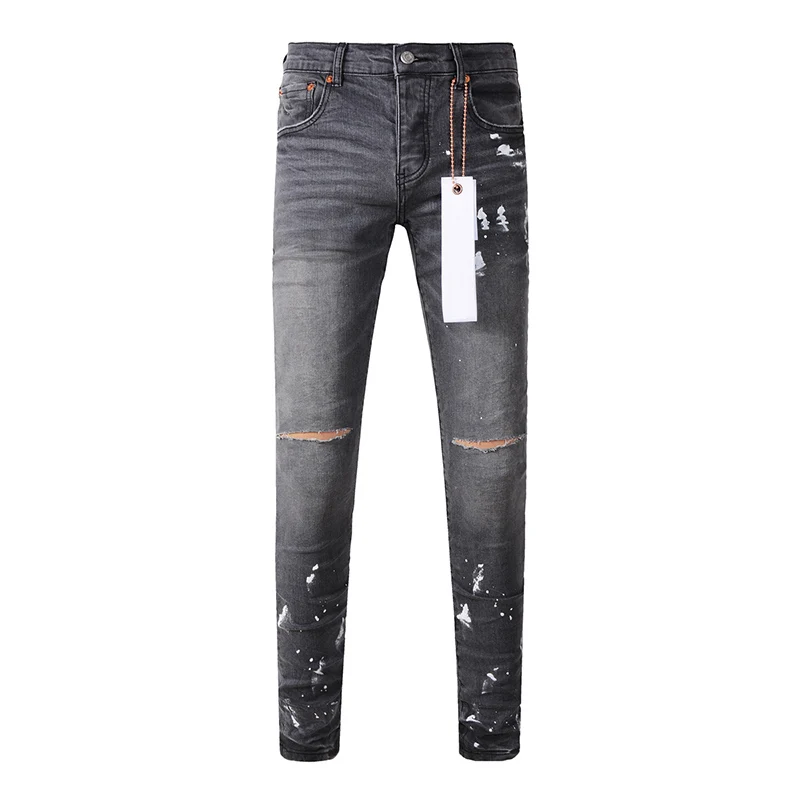 جينز رجالي من American High Street Fashion ذو ثقوب تالفة باللون الرمادي المتعثر على الجدران، جينز ممزق بأزرار قابلة للتمدد