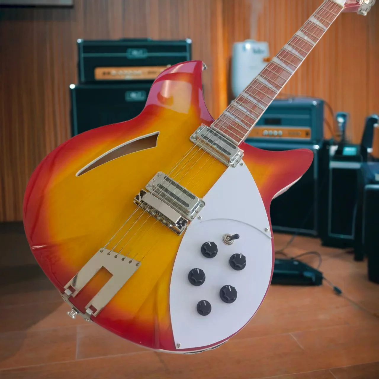 Semi-Hollow Electric Guitar in Red-Orange Sunburst Finish – Featuring A Signature Slender F-Hole on The Upper Left Bout