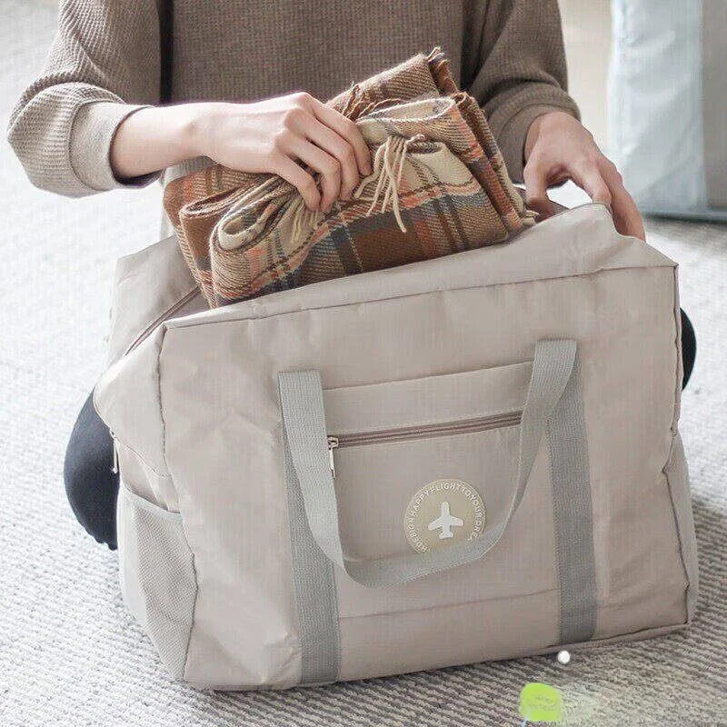 

Large Capacity Travel Bag with Handle Luggage Carrier Student Blanket Storage Bag Portable Delivery Bag Clothing Storage Bag