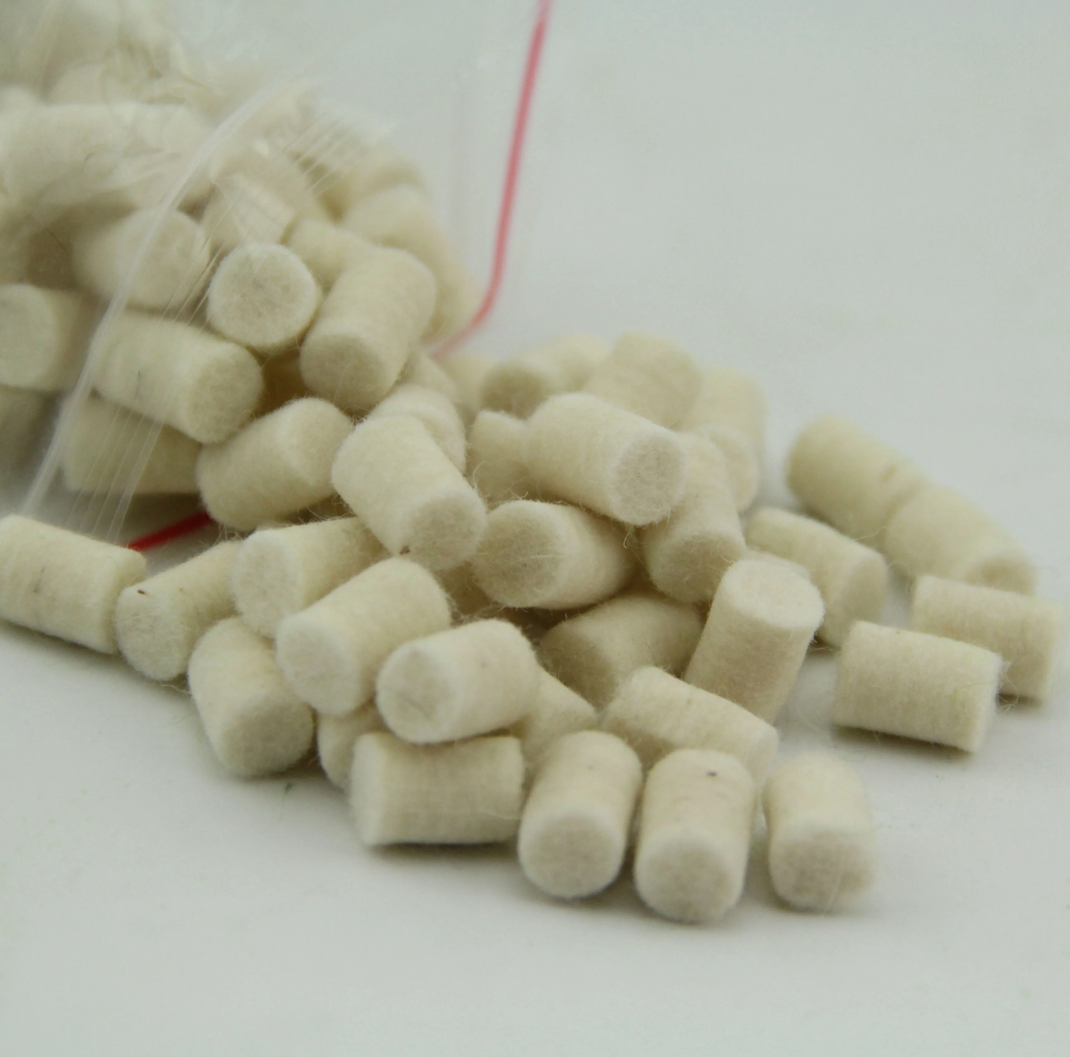A set of 20 white Saxophone felt columns
