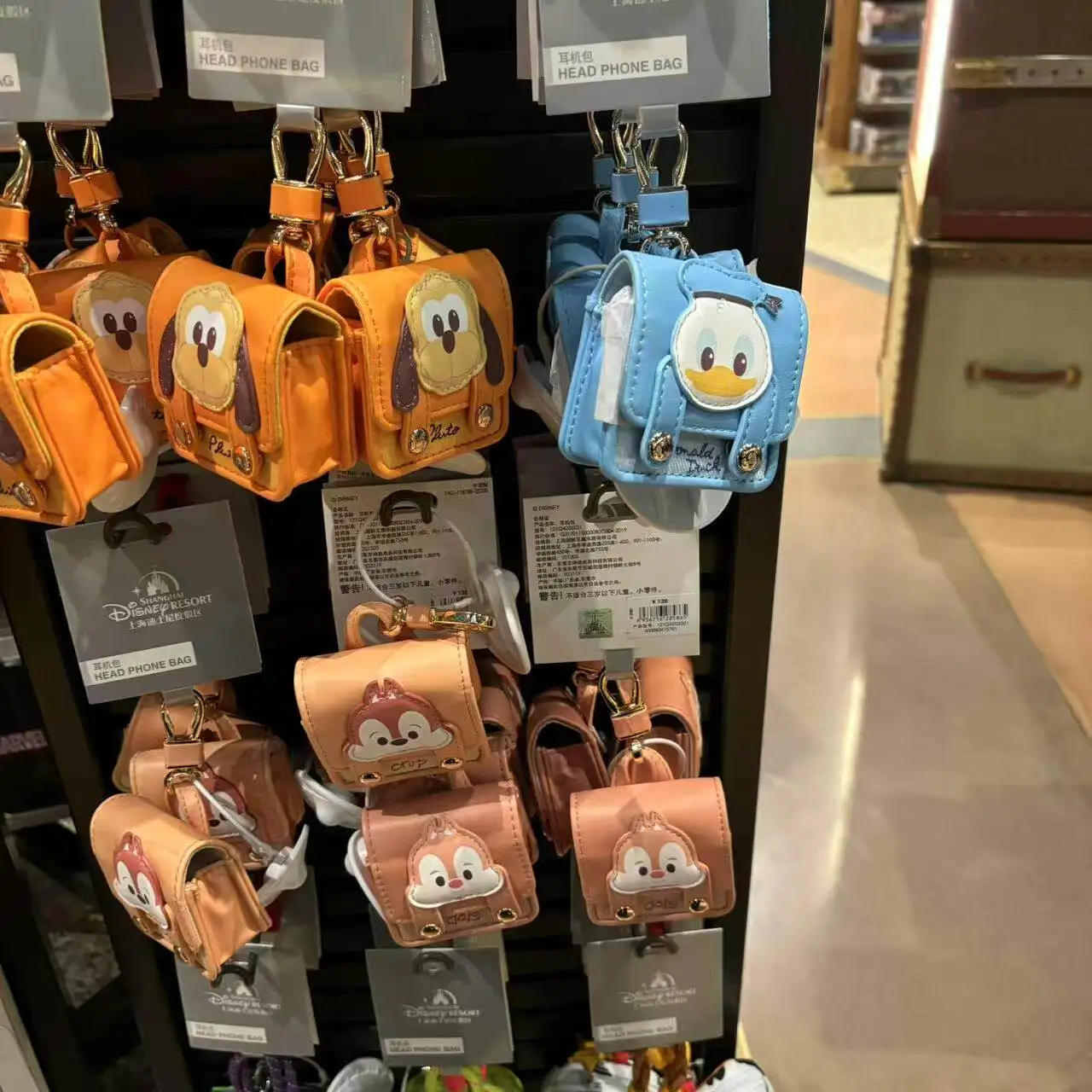 

official Shanghai Disney Resort earphone/earbud case, designed as a cute mini backpack keychain