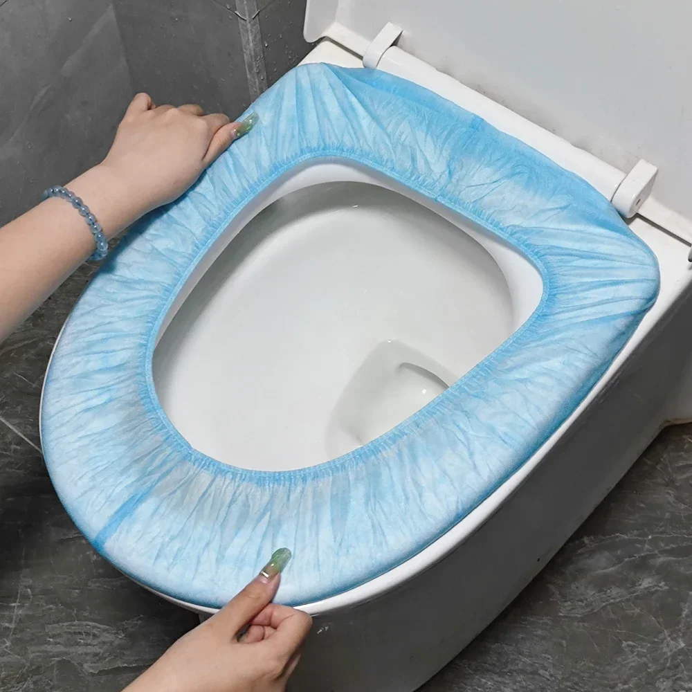 Almohadilla desechable de seguridad para asiento de inodoro, cubierta de papel higiénico portátil, impermeable, no tejida, 50 piezas