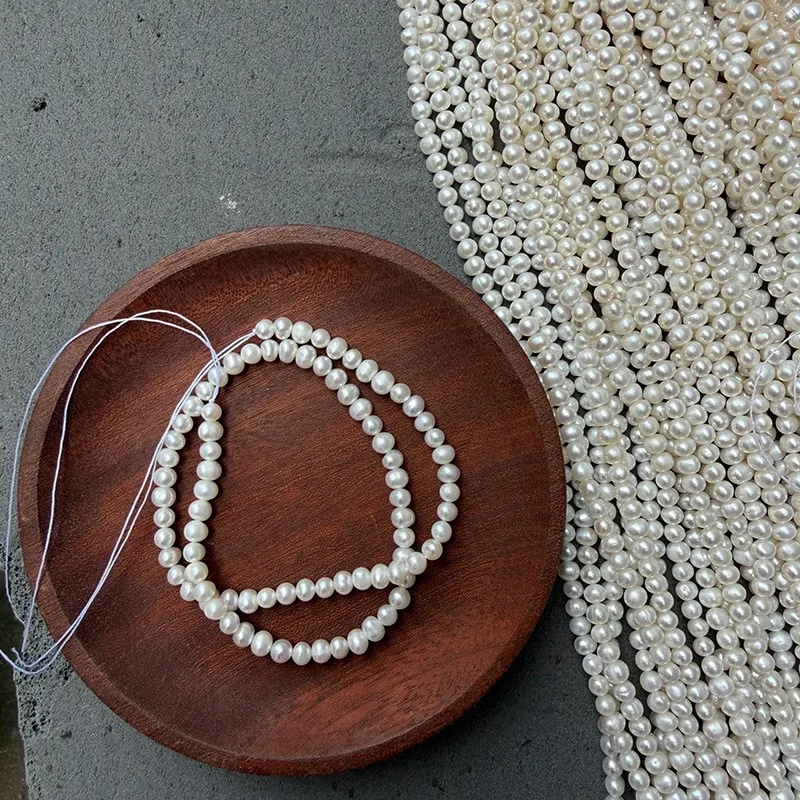 A string of 4-5mm nucleus-free potato-shaped freshwater pearls for DIY handcraft, approximately 36cm long with about 78 beads.