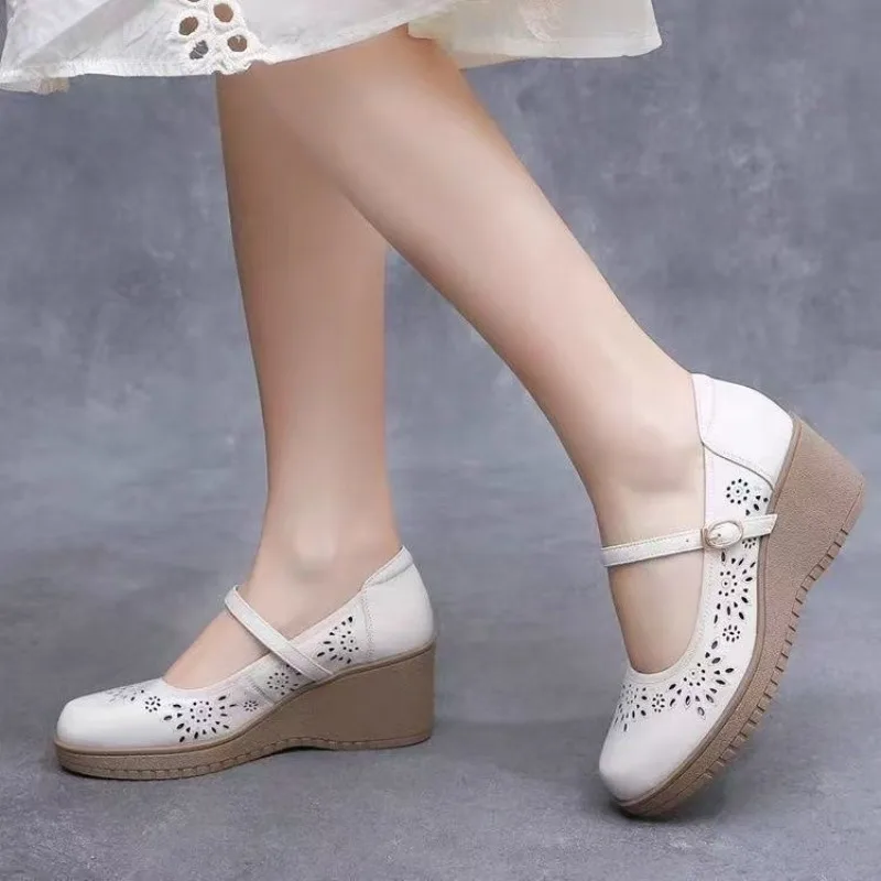 Slope heel shallow mouth fashionable retro hollow sandals spring and summer new round toe breathable single shoe