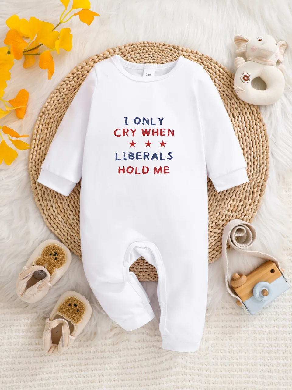 A baby long-sleeved onesie with interesting letter prints. It features a buttoned design for easy putting on and taking off, and