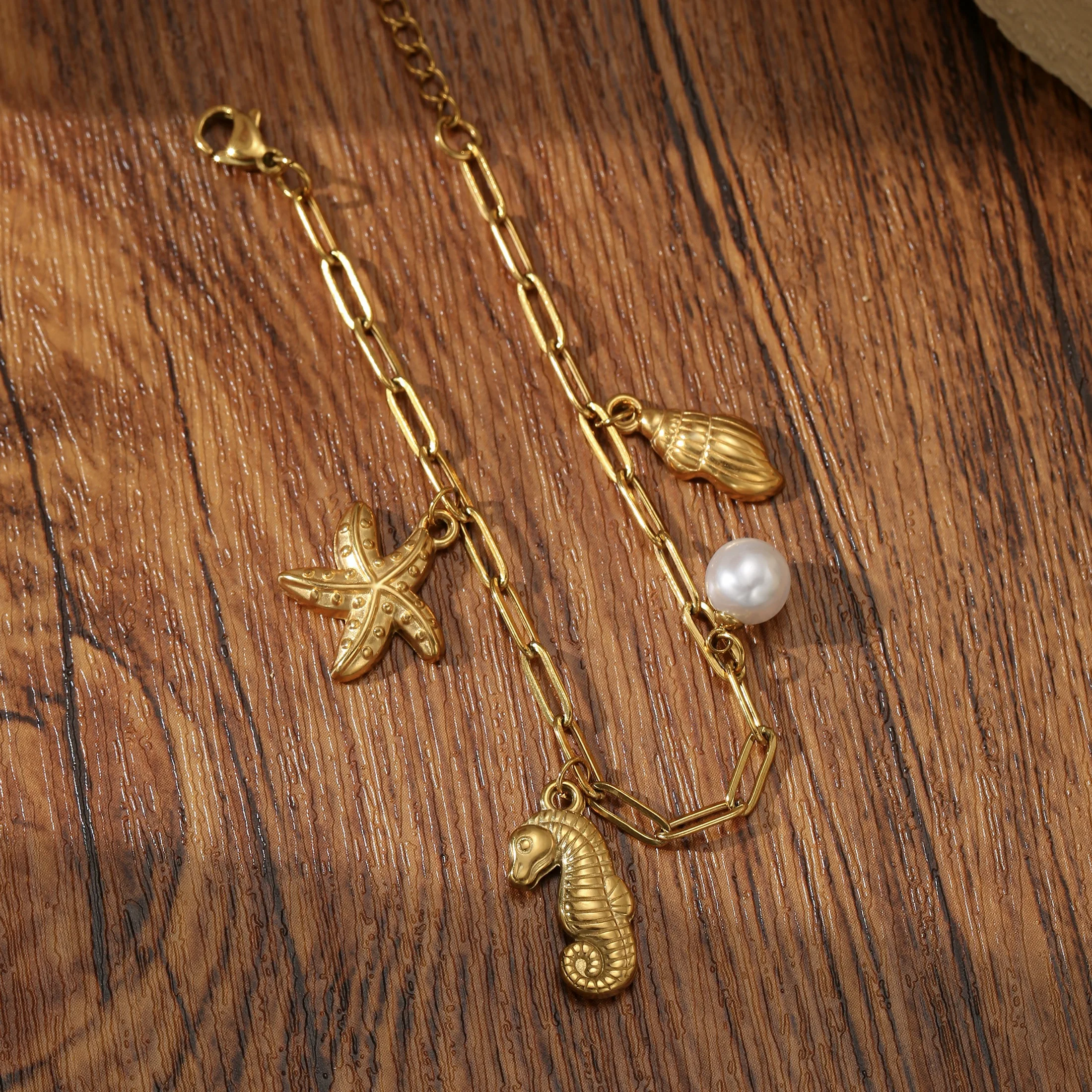 

Golden Tone Stainless Steel Ocean Charm Bracelet with Seahorse and Imitation Pearl for Women