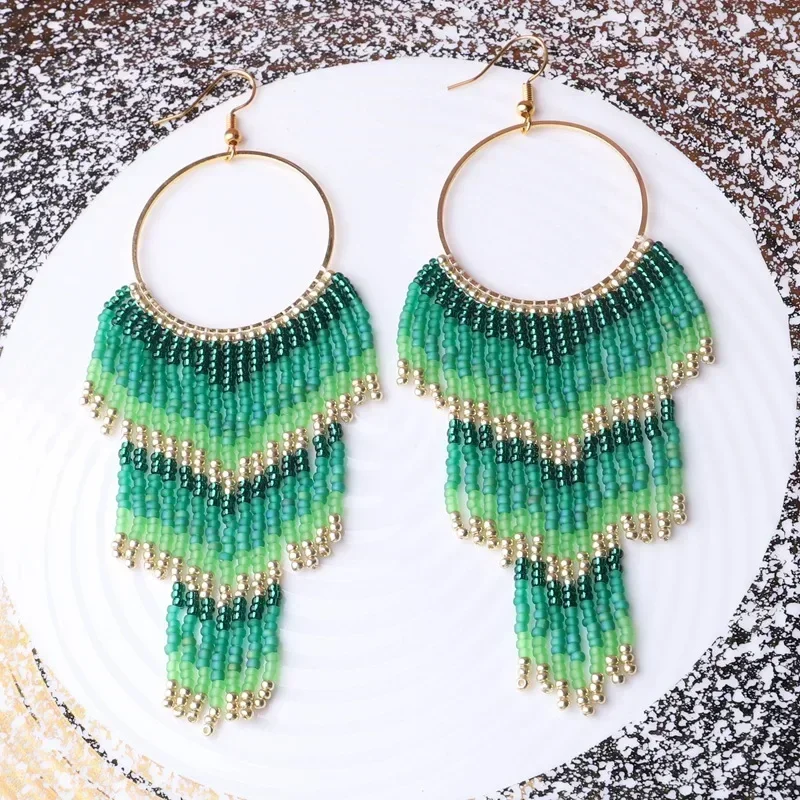 ZGMXR Rice bead earrings Circle Tassel Arrow Bohemia Gradient color Hand knitting Alloy Design Fashion  Simple Beaded earrings
