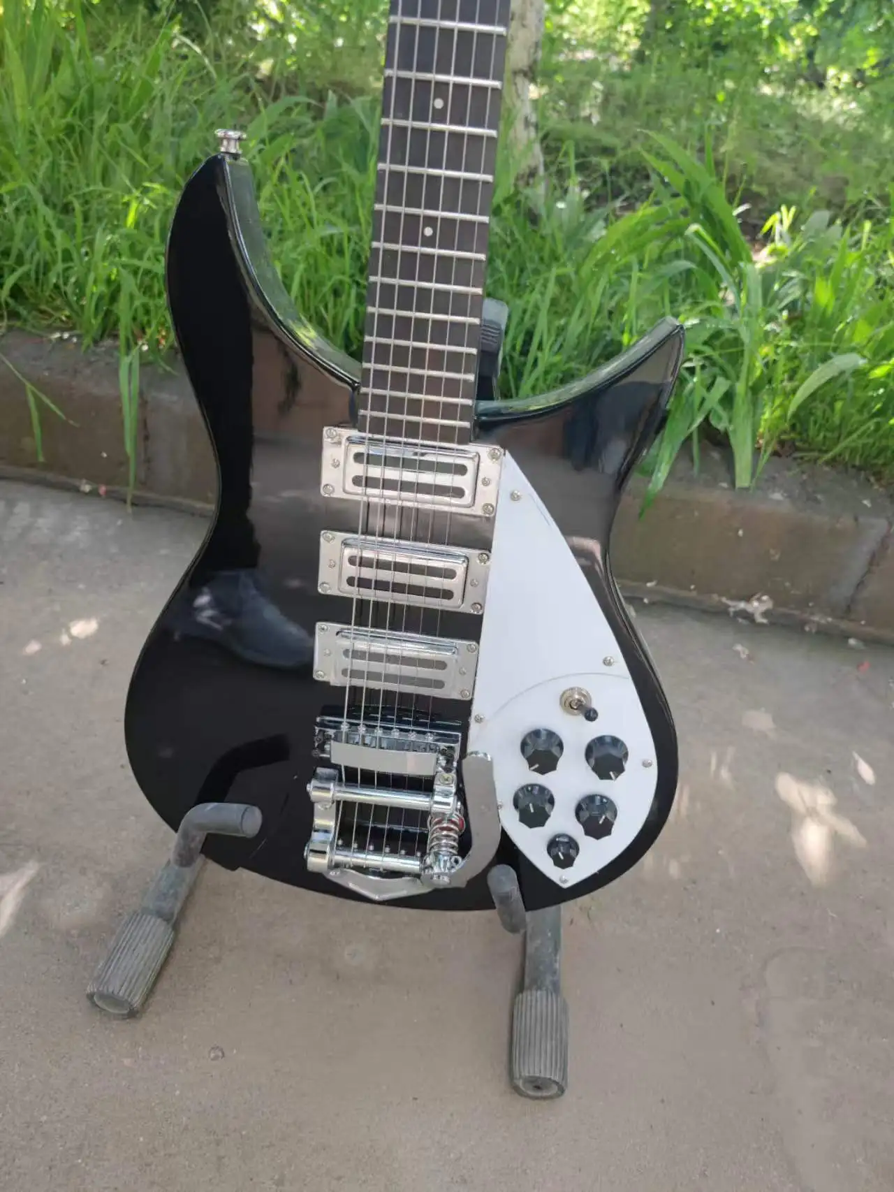 6strings black electric guitar, with a strange shape. High-quality, made of rosewood. Ships within 20 days.