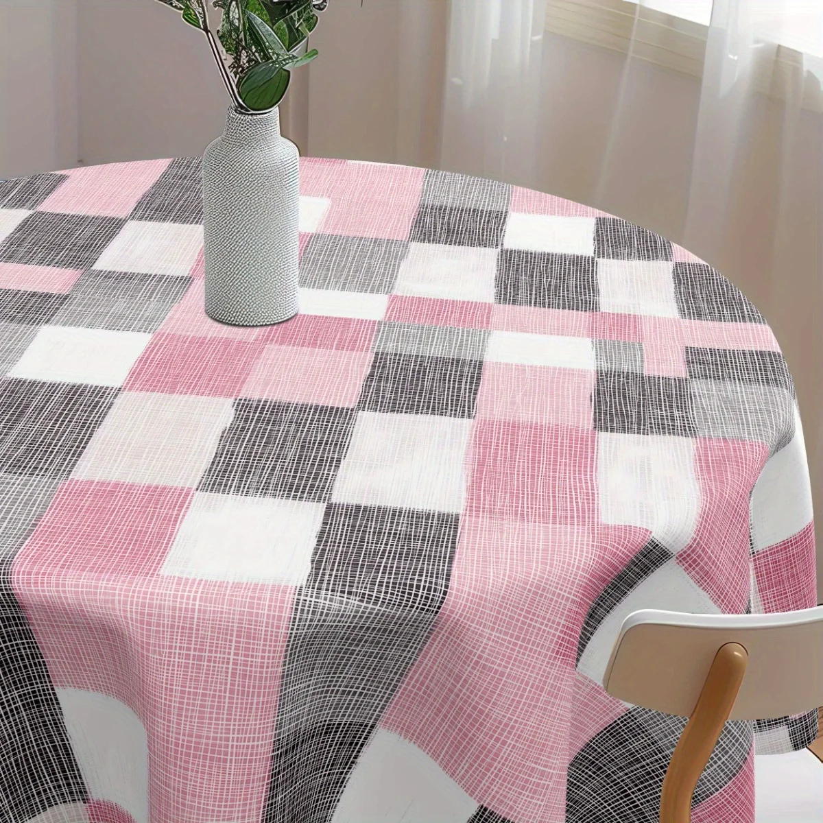 One grey, pink and white checked polyester tablecloth - for a birthday party