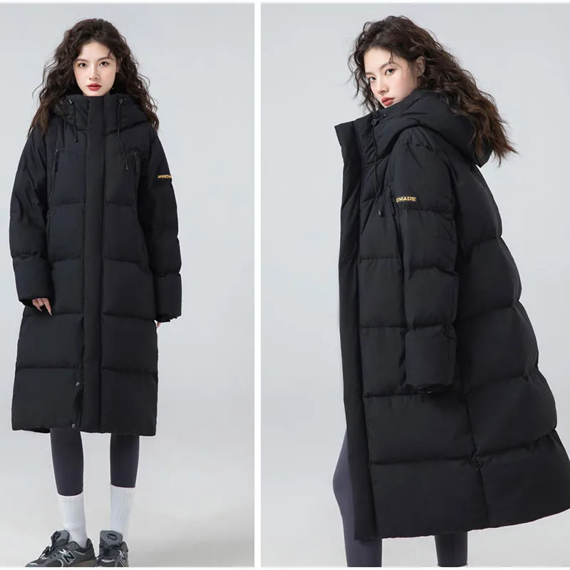 2025 Nuovo piumino da donna di alta qualità in piuma d'anatra bianca alla moda ed elegante Piumino da donna con cappuccio caldo invernale