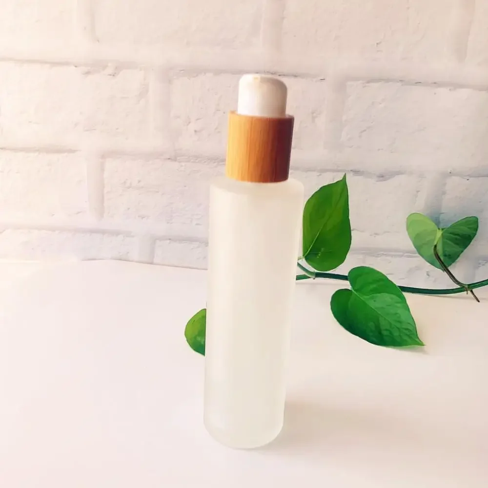 

whosesale Hot Sale qualityBamboo wood covered with Shampoo Cap Spray Cap Frosted Glass Bottles bottles for cosmetics container