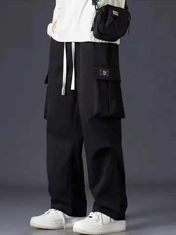 Pantaloni cargo casual neri dritti Pantaloni da jogging da uomo Pantaloni chino da esterno Pantaloni da paracadute larghi coreani da esterno Gamba larga