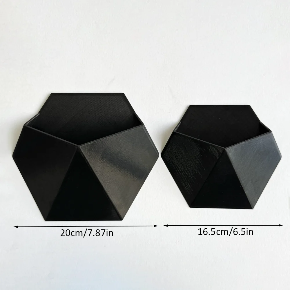 The Black Hexagonal Wall-Mounted Flower Pot Has a Simple and Unique Design. Its Hole Structure Makes It Easy to Install and Is S