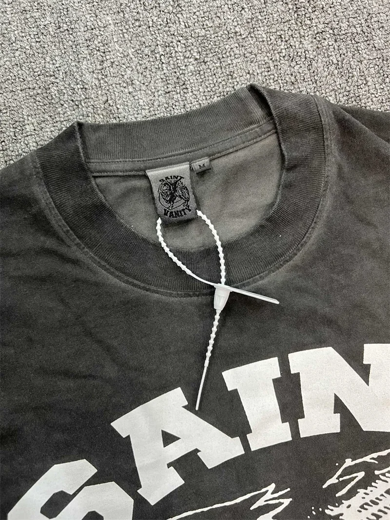 تي شيرت كلاسيكي مغسول باللون الأسود Saint تي شيرت كاجوال للرجال مطبوع عليه رسومات