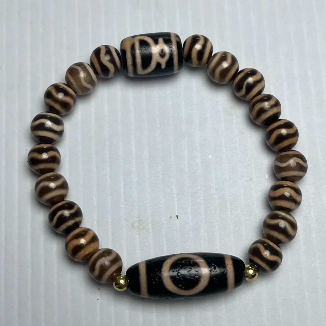 

Natural agate teeth yellow tiger teeth dzi beads round beads God of Wealth multi-treasure chains scattered beads bracelets and a