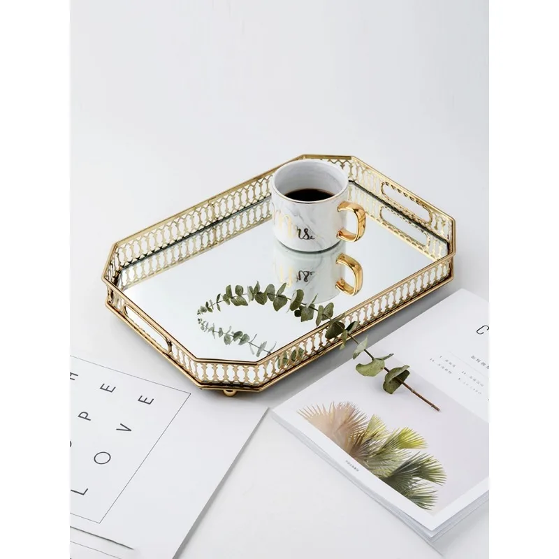 

Nordic style mirror glass gold storage tray European-style home living room coffee table luxury high sense teacups and plates.