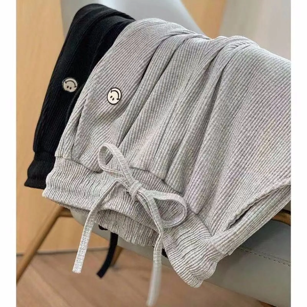 Eleganckie, codzienne spodnie damskie o prostych nogawkach z uroczym nadrukiem uśmiechniętej twarzy, ze sznurkiem, luźne, długie, do biura, nowa kolekcja odzieży damskiej.