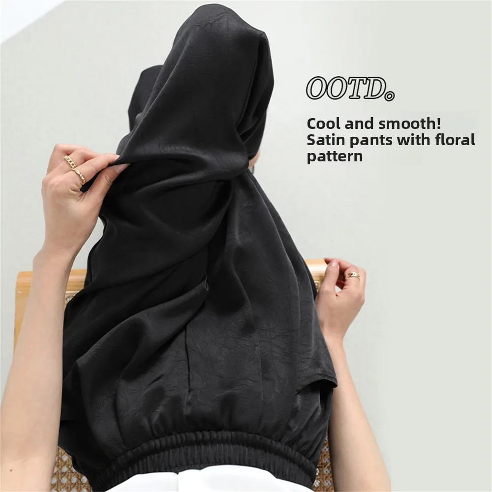 Jedwabiste, gładkie spodnie z szerokimi nogawkami, elastyczną talią, luźnym krojem, zdobione kwiatowym wzorem, codzienne spodnie damskie na wiosnę.