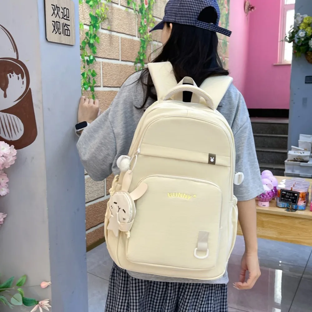 Nylon fabric lightweight and simple student schoolbag, 16-inch large-capacity female computer backpack, cute pendant travel bag