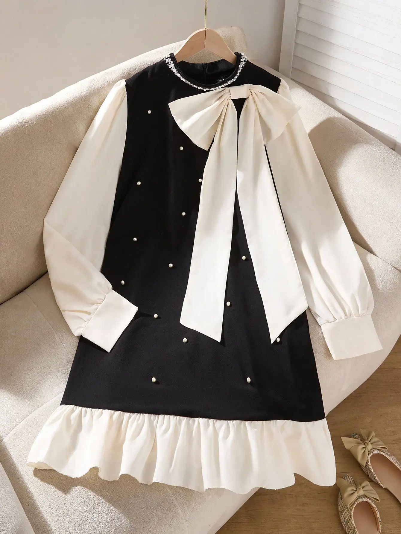 Black & Cream Color Block Dress with Pearl Studs, Bow Neck and Ruffle Hem