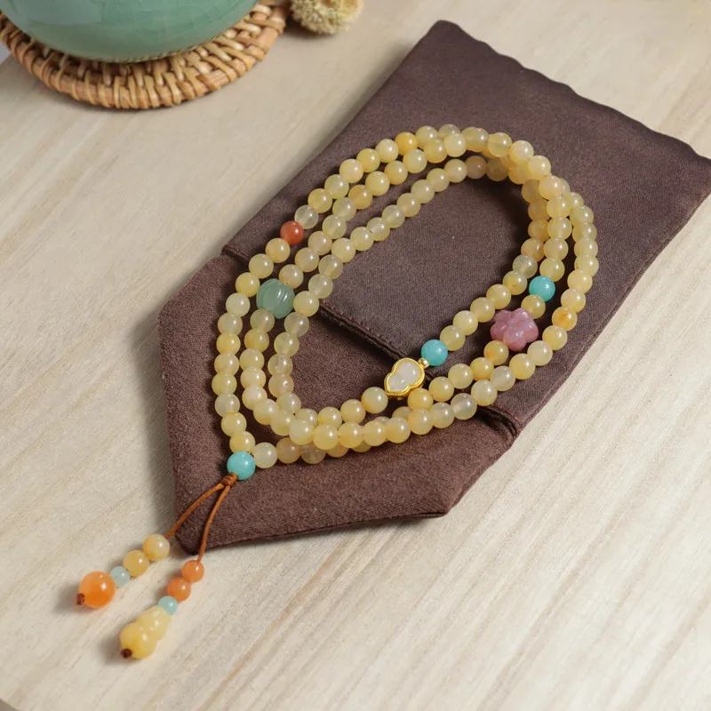 

Натуральный золотой шелк - подвеска из желтого нефрита Dongling Fortune Multi-Circle Sweater