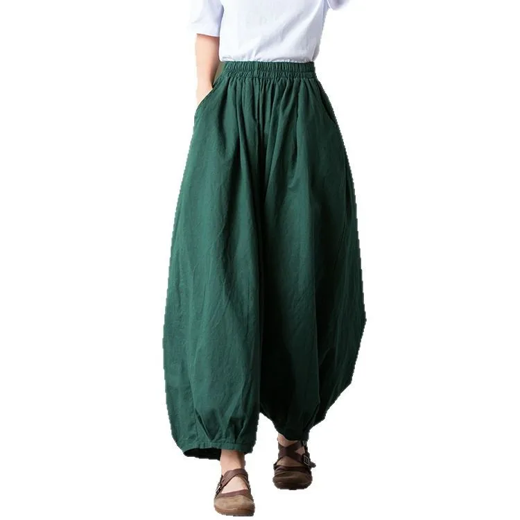 A/W stone-washed linen harem pants with an elastic waist and cropped ankle length for a relaxed fit.