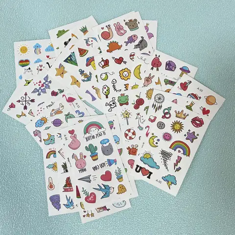 30 feuilles de tatouages temporaires de dessin animé mignon pour les mains autocollants de tatouage imperméables arc-en-ciel fruits lune faux tatouage de doigt