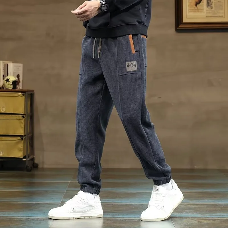 

Модные мужские вельветовые повседневные брюки: новинка весна-осень, трендовые брендовые спортивные штаны, универсальные брюки с манжетами, облегающие спортивные брюки.