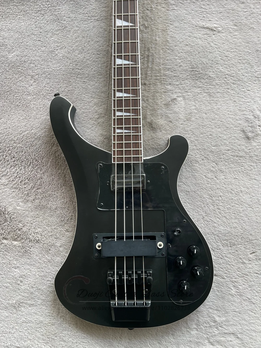 4 string matte black bass, fixed bridge, maple neck set in solid body, black hardware, customizable color
