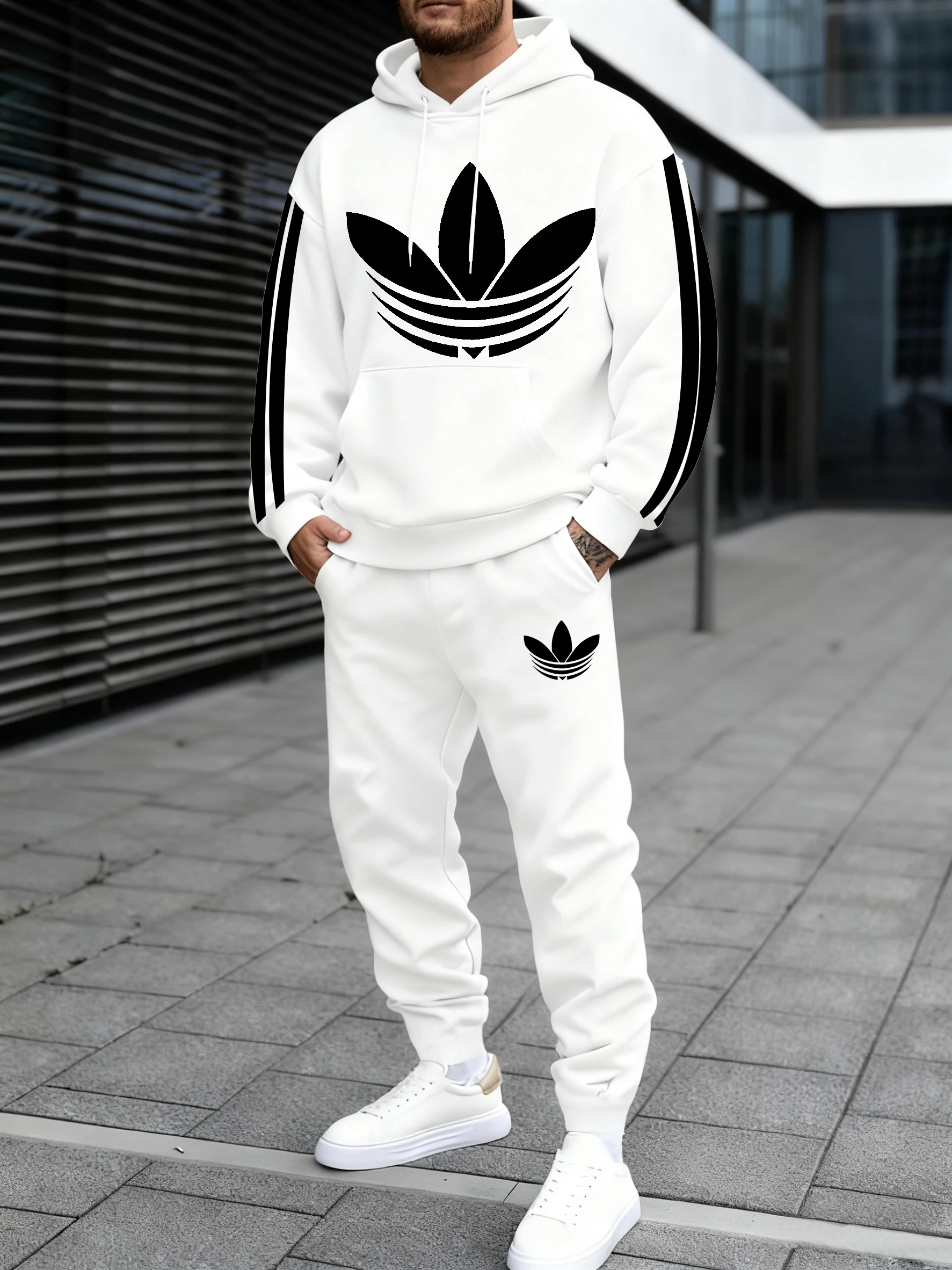 سويت شيرت رجالي بغطاء للرأس يقترن بنطال رياضي، مع خط هندسي بيضاوي متباين الألوان، ينبع نمط شارع متعدد الاستخدامات