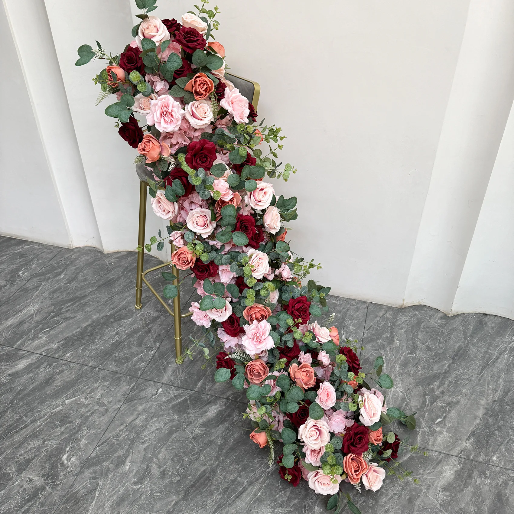 

Pink rose flower balls wedding arch background decoration long row of flowers table placement